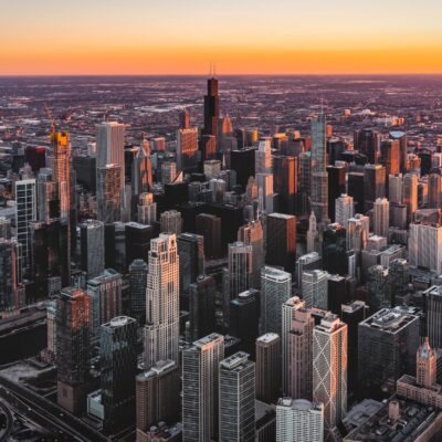 City scape of Chicago with sun setting in the background.