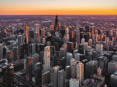 City scape of Chicago with the sun setting in the background.