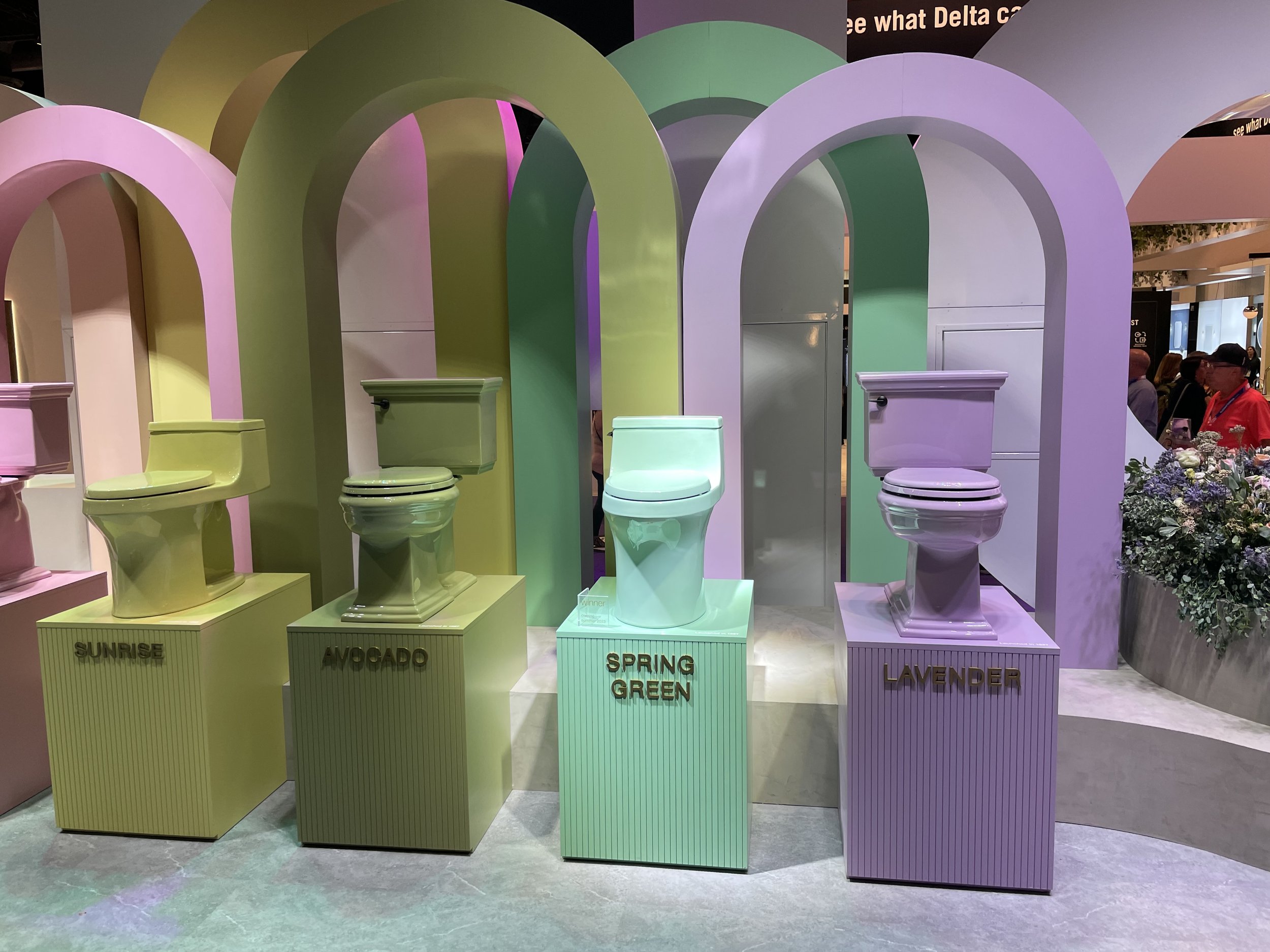 Display of colorful toilets at the 2023 NRF Big Show.