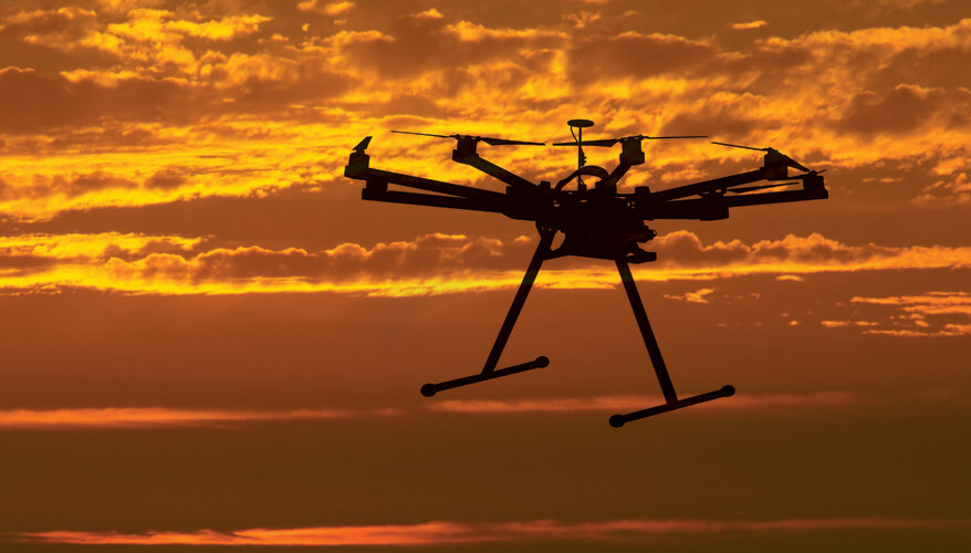 A hi-tech drone flying midair.