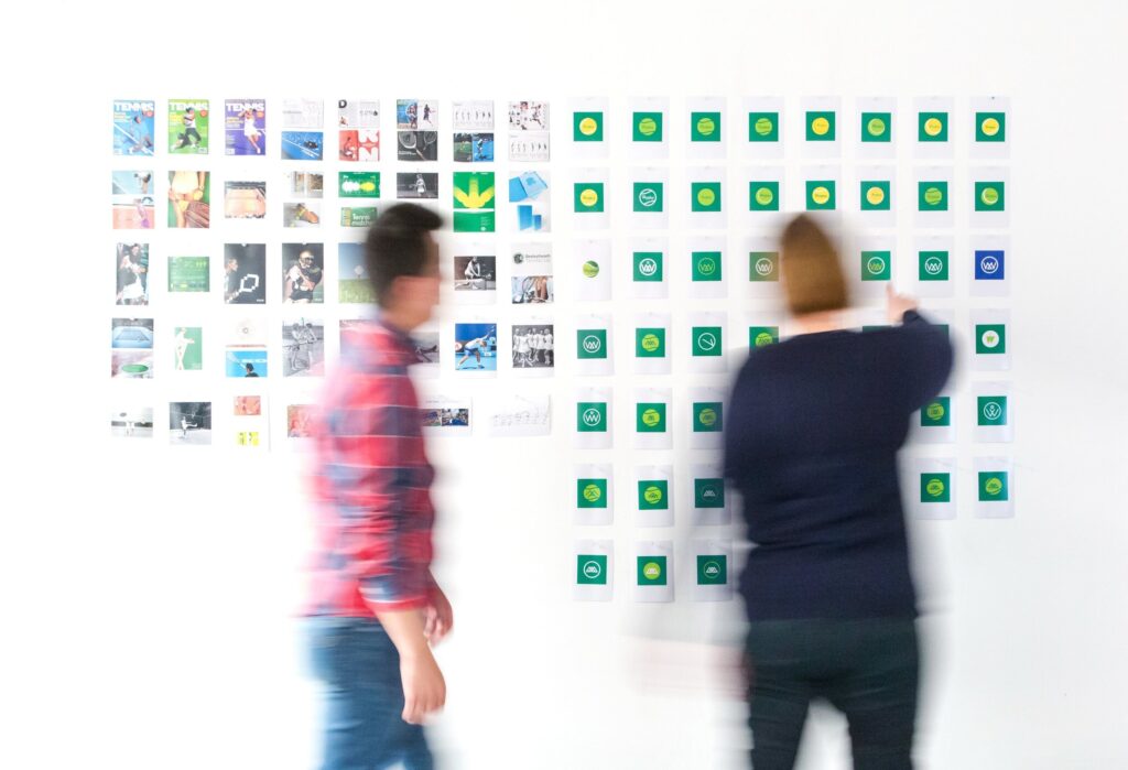 People working together at an idea board.