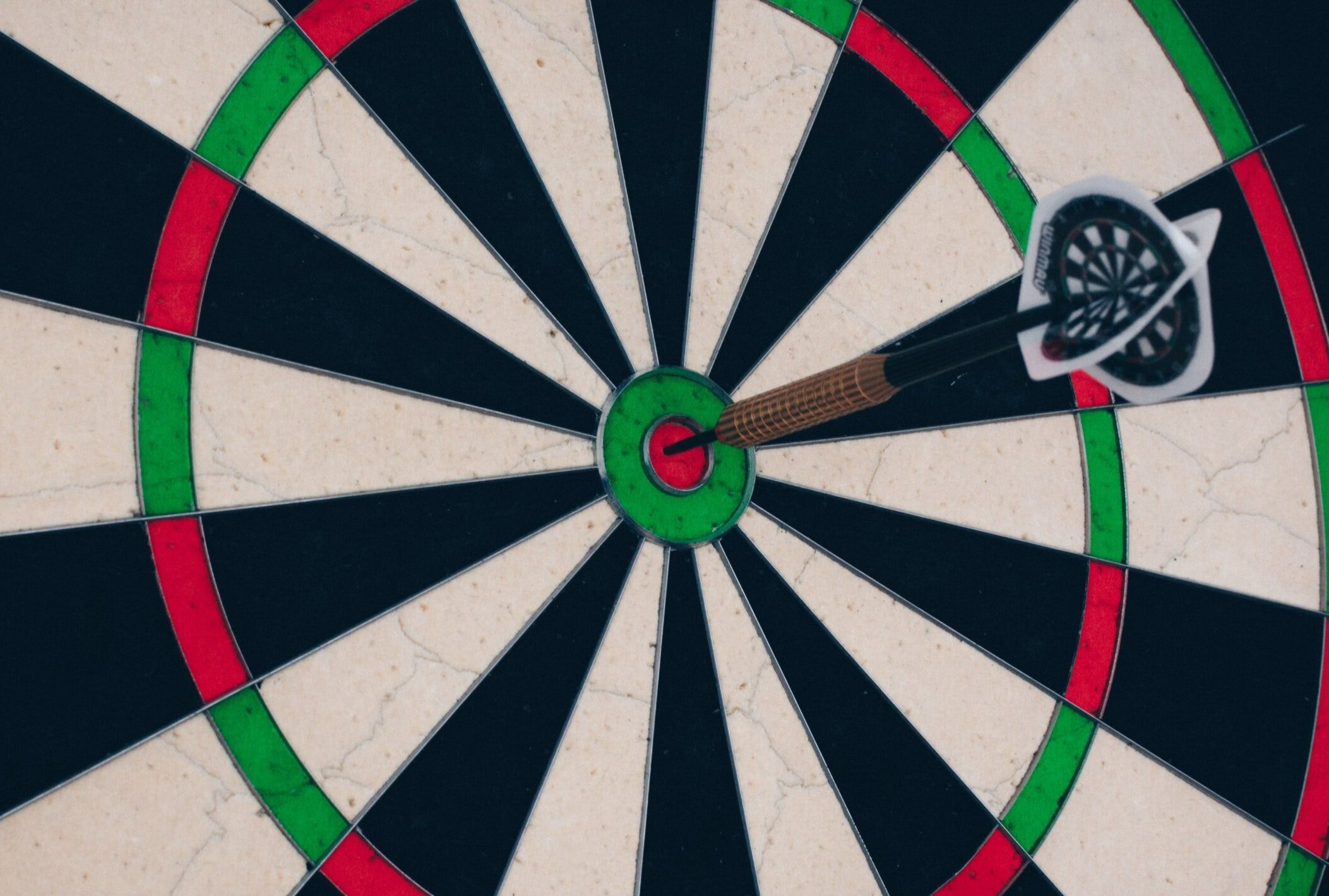 A dart that has landed on a bullseye.