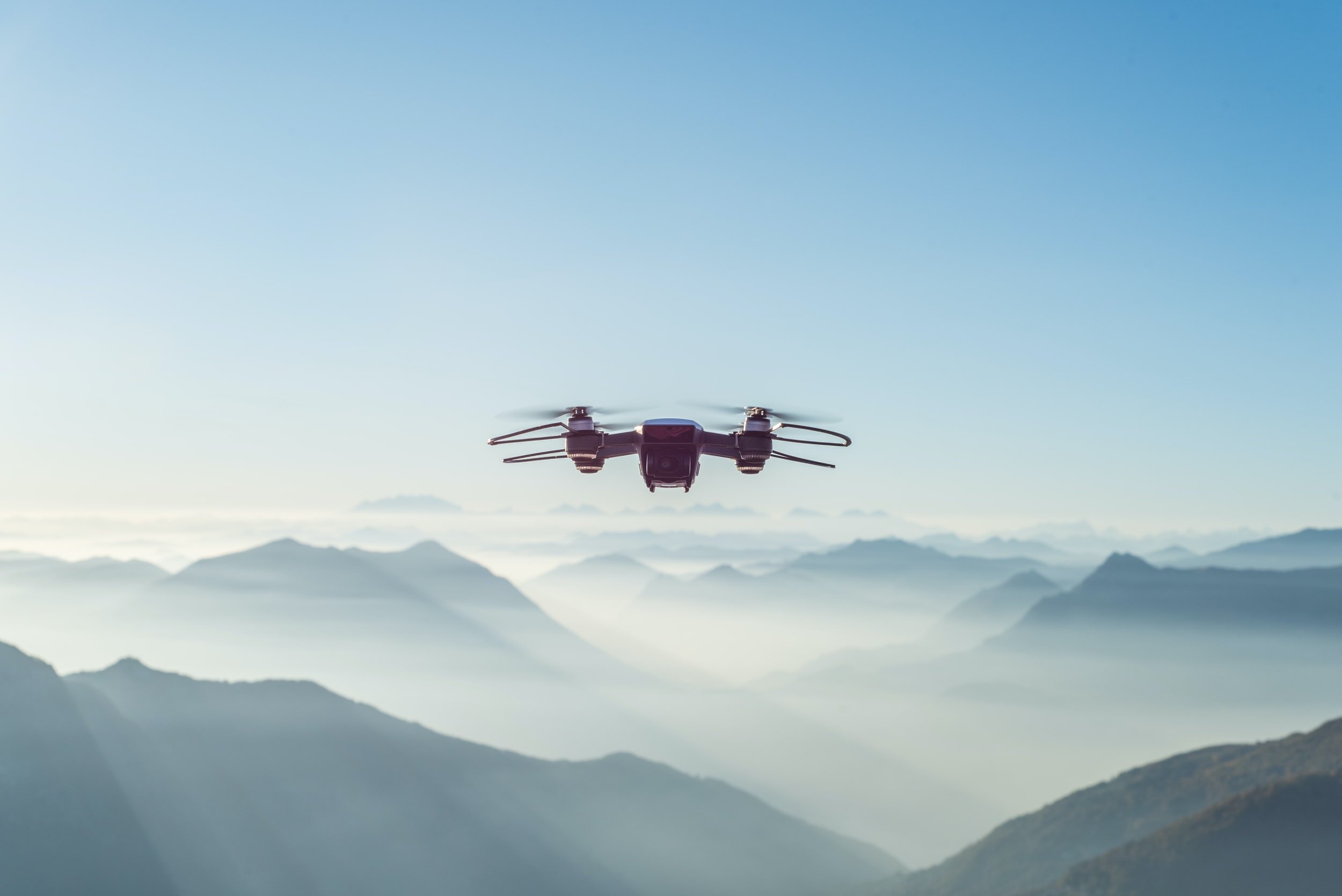 A hi-tech drone flying midair.