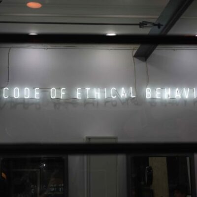 Neon sign with words, "Code of Ethical Behavior."