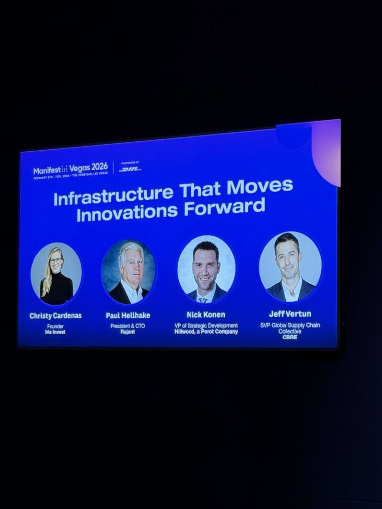 A conference slide reads, "Infrastructure That Moves Innovations Forward," featuring photos and titles of four panelists: Christy Cardenas, Paul Hellhake, Nick Konen, and Jeff Vertun, at Manifest Vegas 2026.